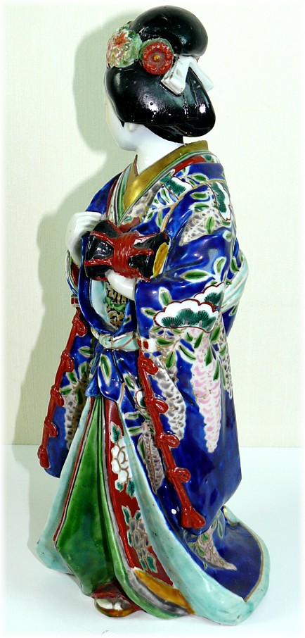 japanese porcelain antique figure of a woman dressed with rich patterned kimono