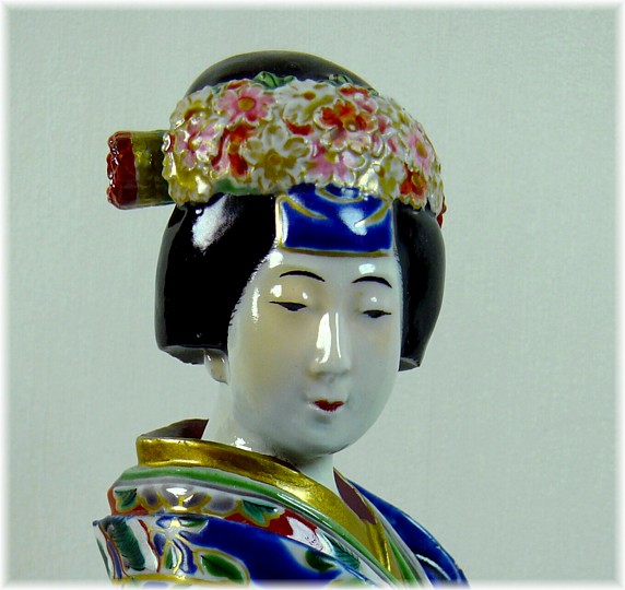 Japanese antique porcelain figurine of a woman in blue kimono