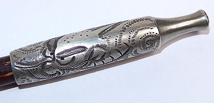 japanese antique tobacco pipe, detail of engraved silver mouthpiece