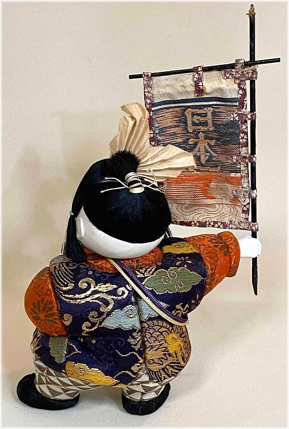 japanese traditional kimekomi doll of a young samurai warrior