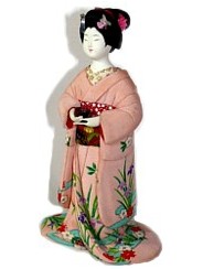 Japanese antique doll of a young lady with tea cup, 1950's