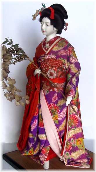 japanese antique doll in embroidered kimono
