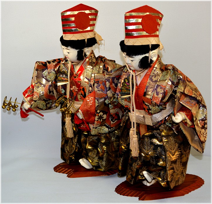 Japanese antique pair of boys dolls dancing with bells in their hands, Meiji period