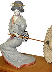 japanese hakata clay figurine of a dancing geisha with umbrella, 1960's