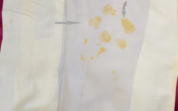 stain inside the sleeve as imprint from upper fabric