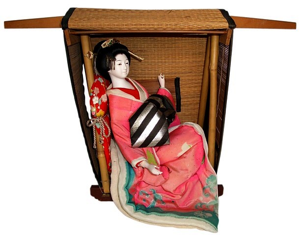 antique japanese geisha doll sitting in straw carriage 1900's
